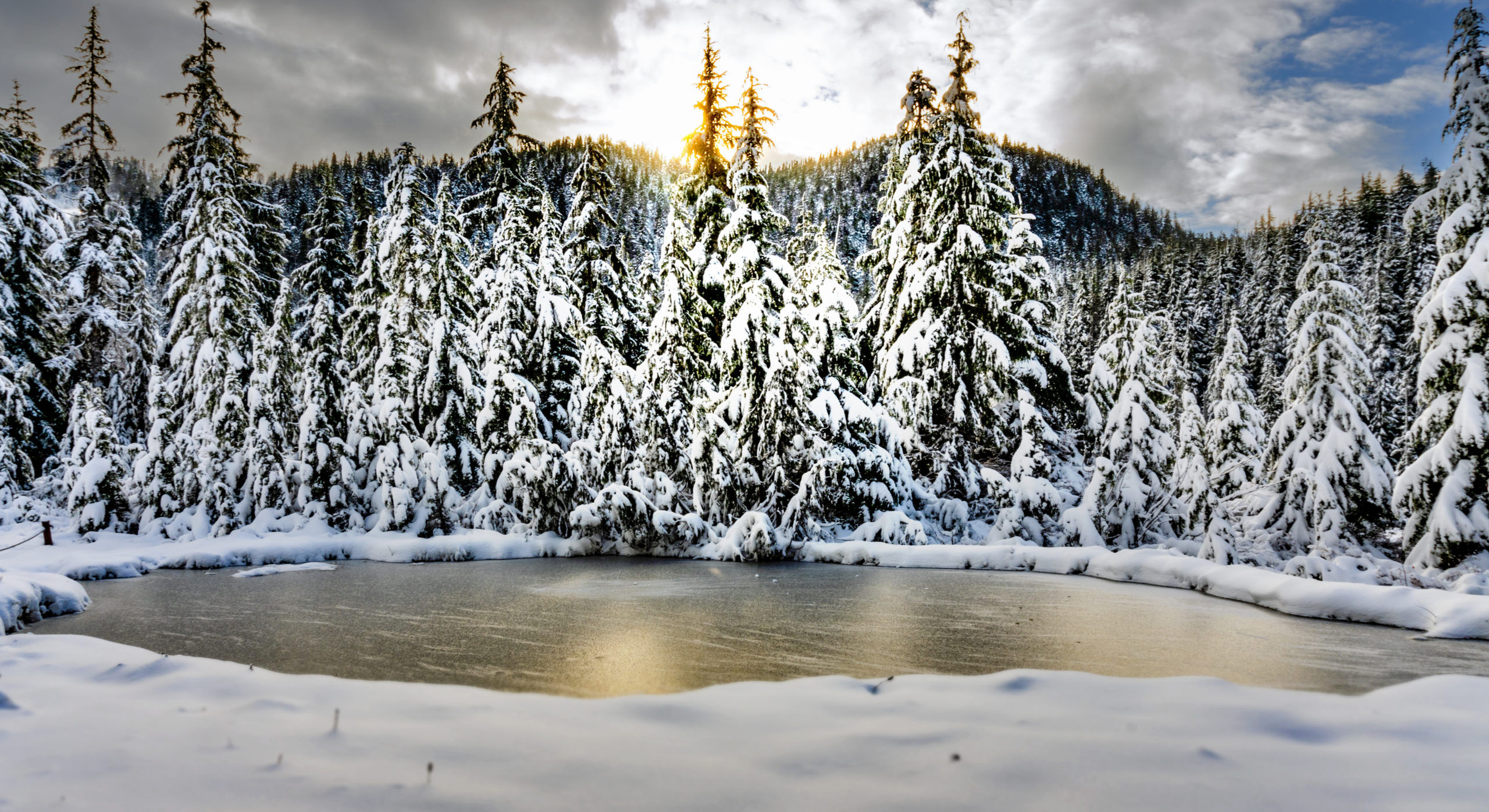 Sunset over frozen lake in Cypress Provincial Park BC Canada